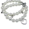 elastisches Armband mit Schmuck Perlen und Herz Anhängern